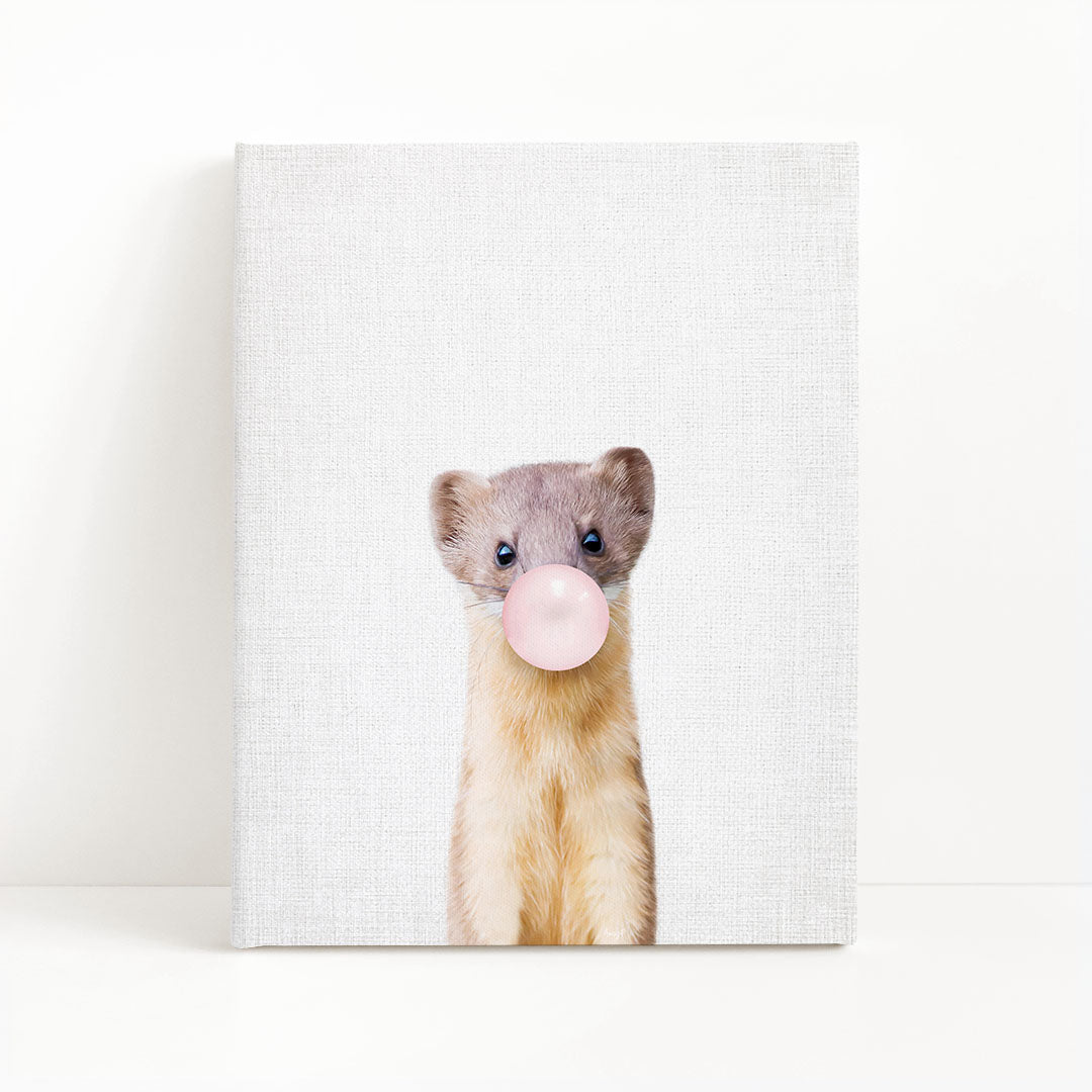 A small animal, possibly a rodent or a similar creature, is blowing a bubble with a pink bubble gum bubble wand.