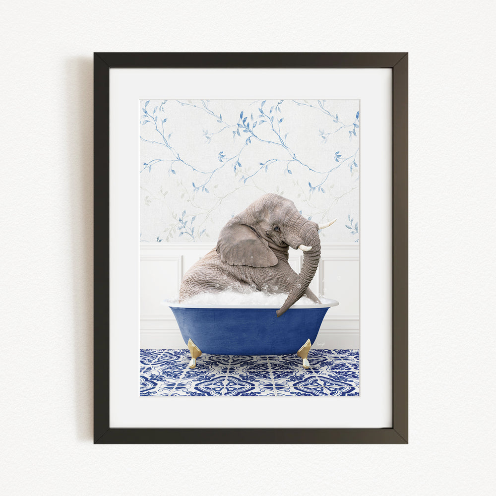 A gray elephant is sitting in a blue bathtub, surrounded by a blue and white patterned floor.