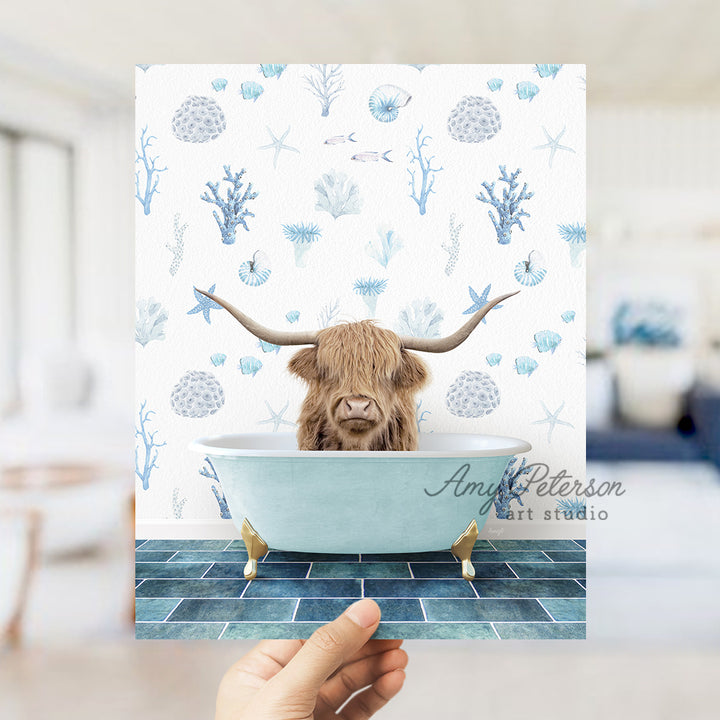 a hand holding up a card with a picture of a bull in a bathtub