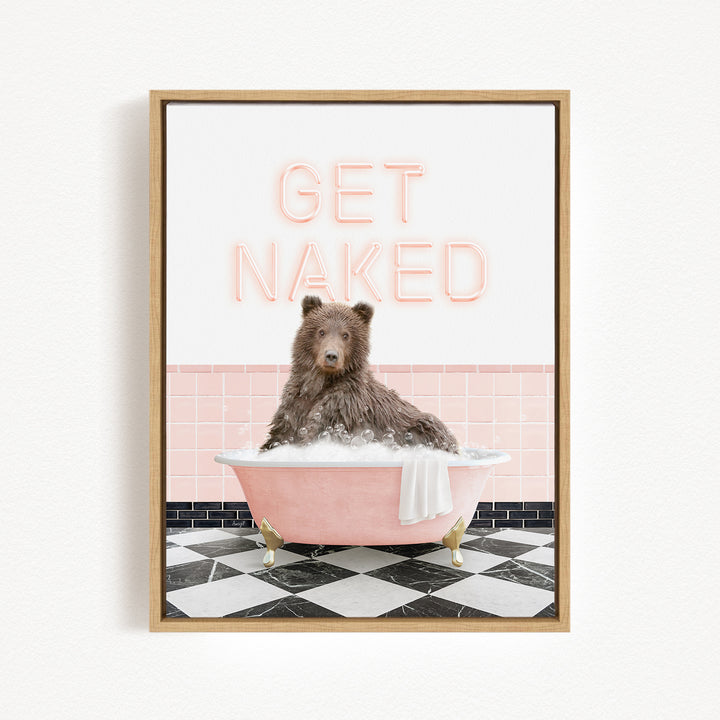 A brown bear sitting in a pink bathtub with the text "GET NAKED" displayed above it.