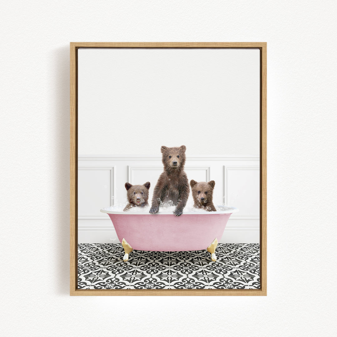 Three adorable brown bears sitting in a pink bathtub, with a black and white patterned floor beneath them.