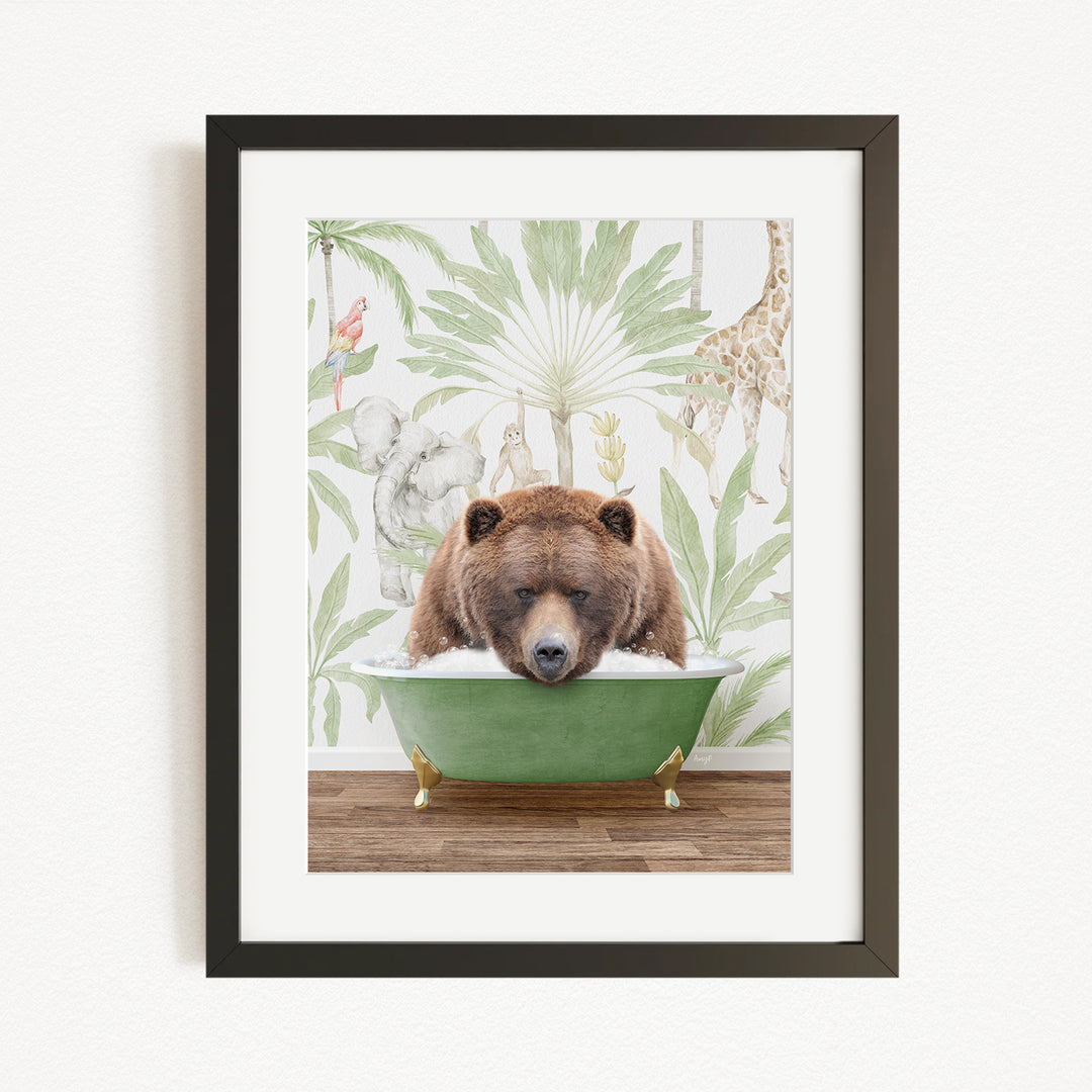A framed image depicting a brown bear sitting in a green bathtub, surrounded by a tropical jungle scene with various animals and plants.