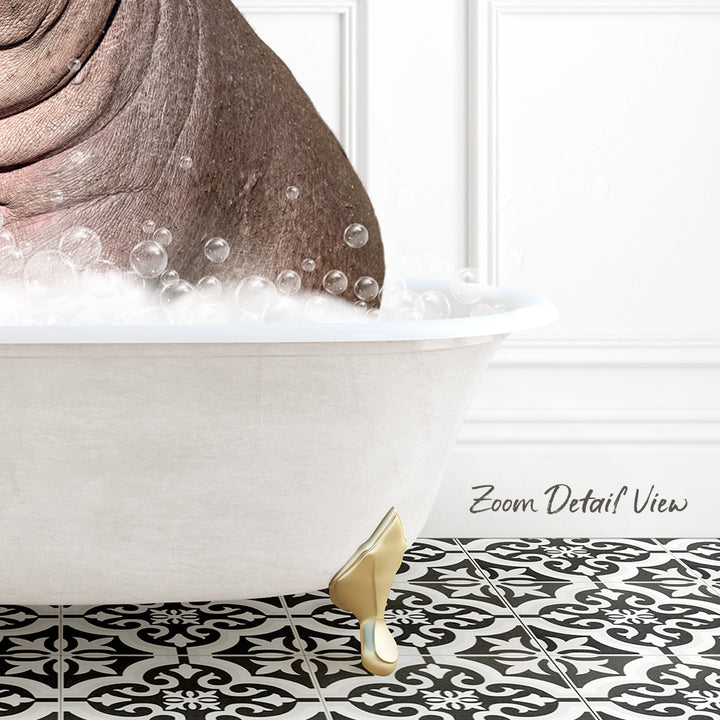 A white bathtub filled with bubbles, with a gold-colored bathtub leg visible, set against a white wall with a black and white patterned tile floor.