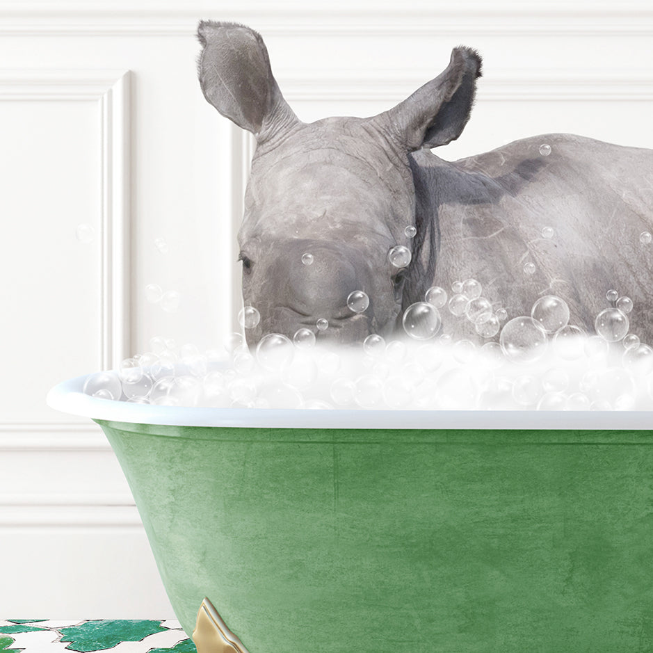 a rhino is taking a bath in a green tub