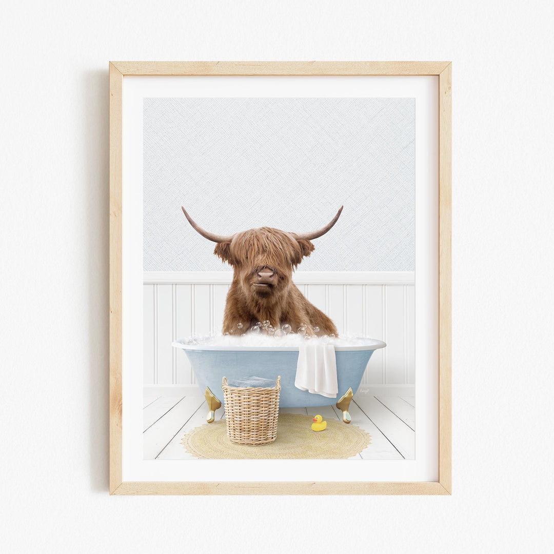 A brown Highland cow with large horns is sitting in a blue bathtub filled with water, surrounded by rubber ducks.