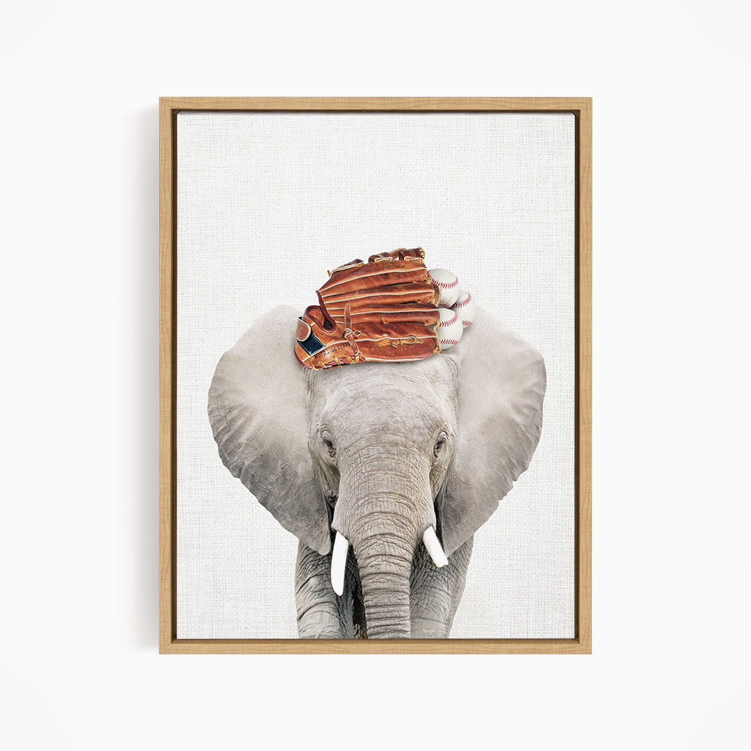 A gray elephant with a baseball glove on its head, standing against a white background.