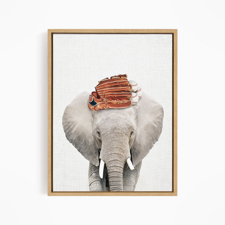 A gray elephant with a baseball glove on its head, standing against a white background.
