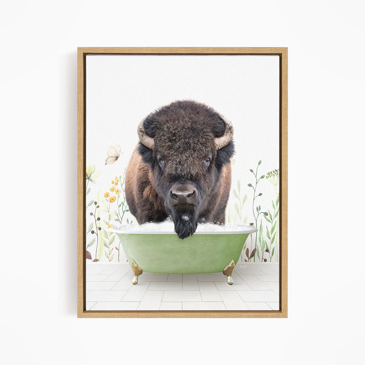 A buffalo with large horns is standing in a green bathtub, surrounded by flowers and plants.
