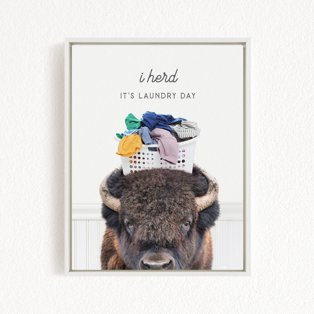 A buffalo with a basket of laundry on its head, accompanied by the text "i herd, it's laundry day".