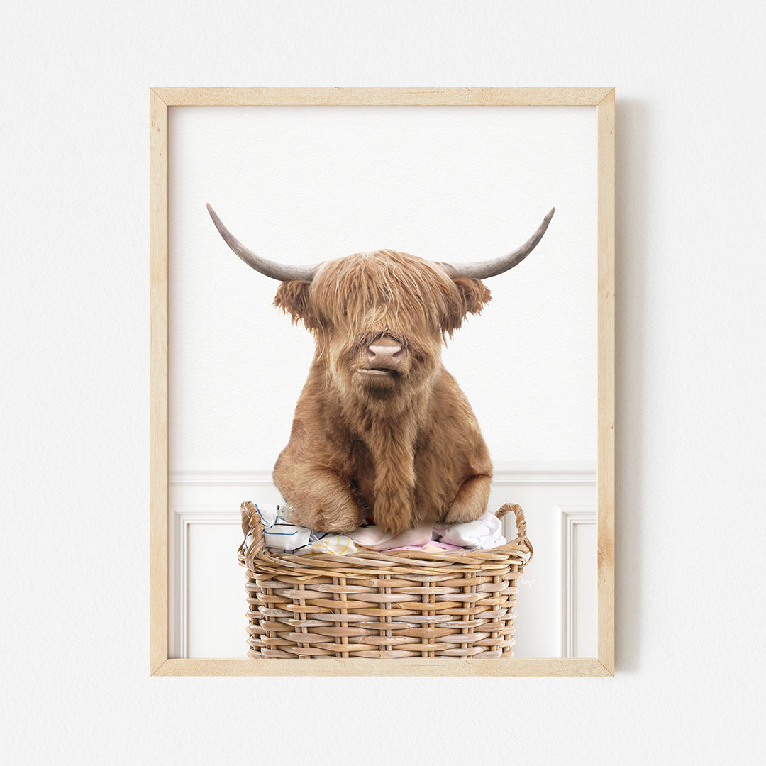 a picture of a brown cow sitting in a basket