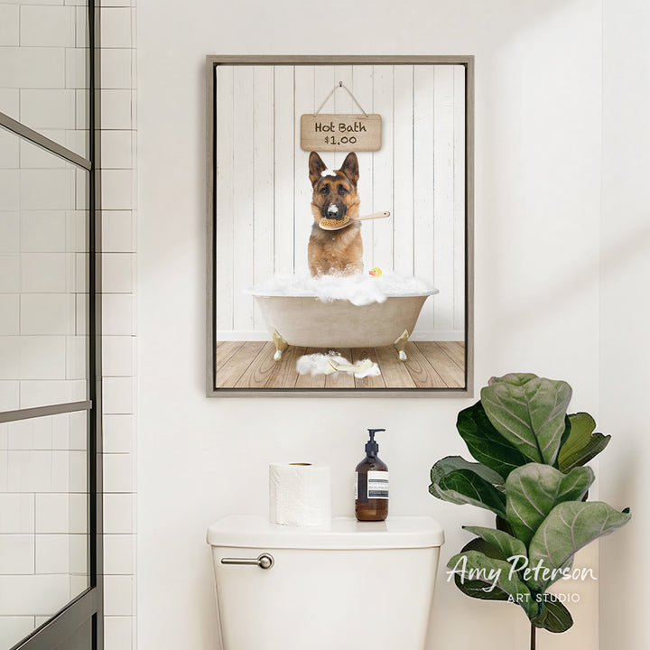 A framed image of a German Shepherd dog sitting in a bathtub, with a sign above it that says "Hot Bath is Go".
