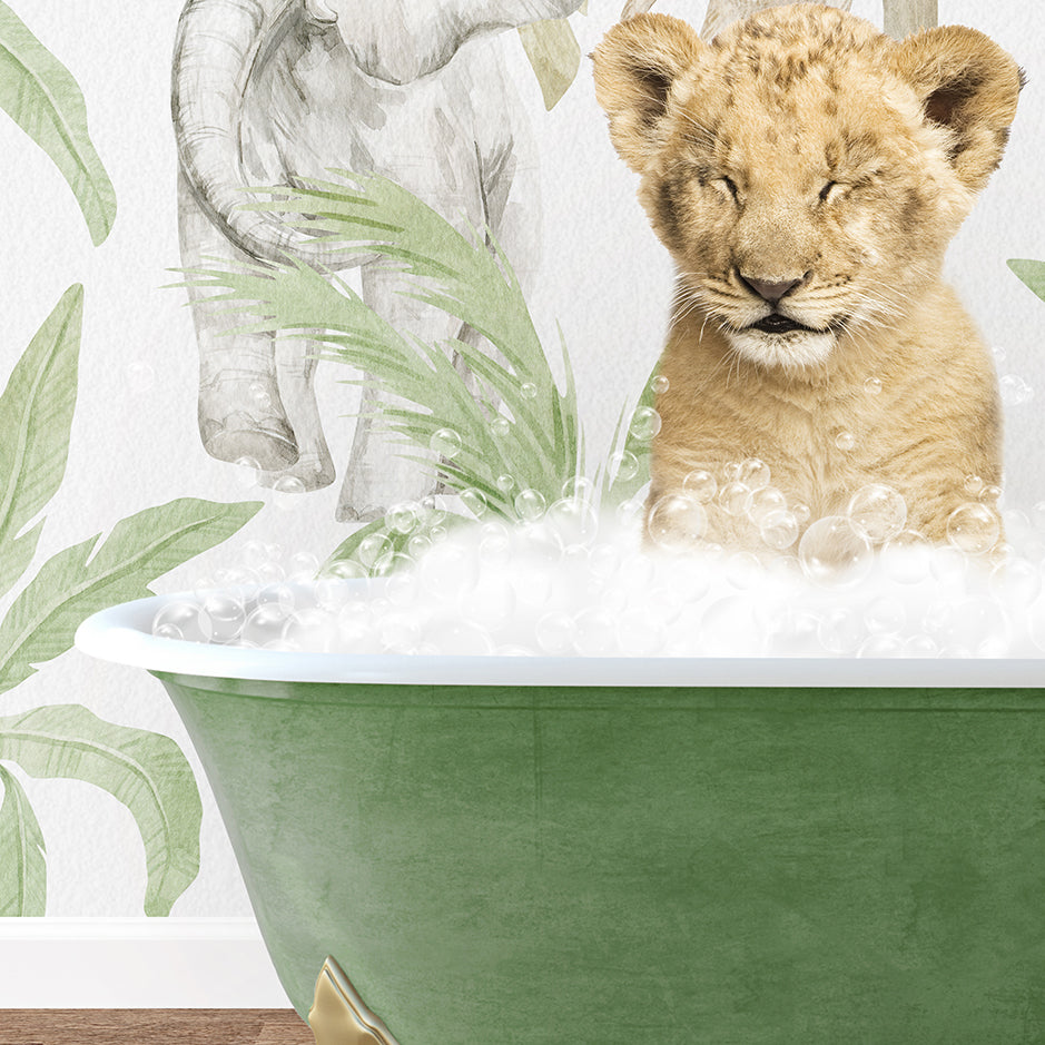 a baby lion sitting in a bathtub filled with bubbles