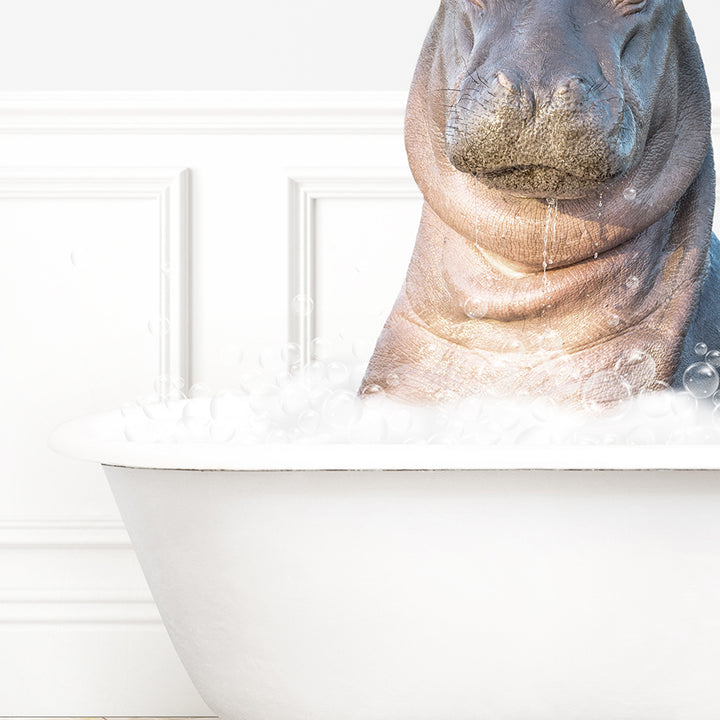 a hippopotamus sitting in a bathtub full of foam