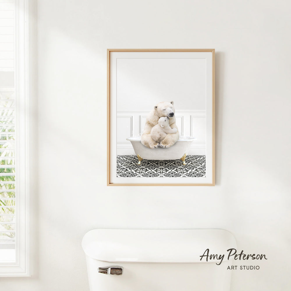 A framed image of a polar bear sitting in a bathtub, with a patterned tile floor beneath it, is hanging on a white wall.