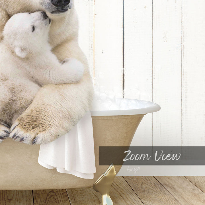 A polar bear cub cuddling with its mother in a bathtub, with bubbles and a towel nearby.
