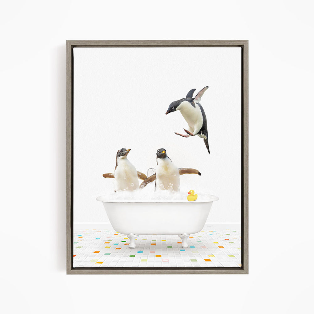 A framed image depicting two penguins sitting in a bathtub, with one penguin flying towards the other penguin.