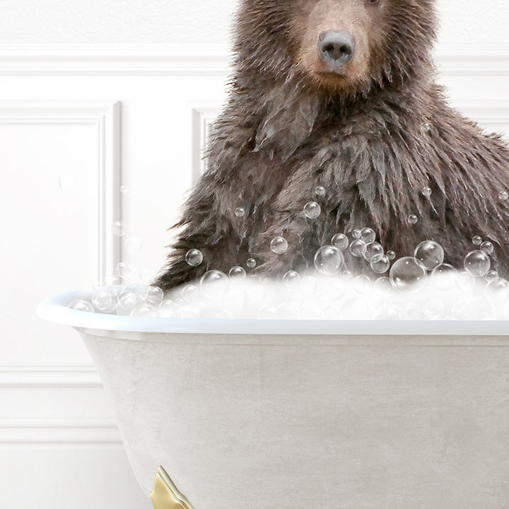 a brown bear sitting in a bathtub filled with bubbles