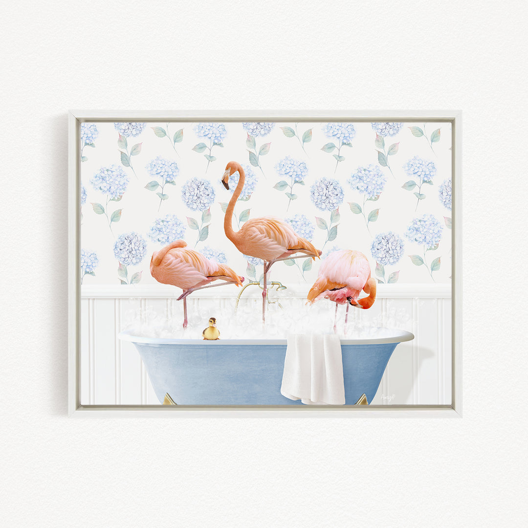 A framed image depicting three flamingos standing in a bathtub filled with water, surrounded by a floral pattern.