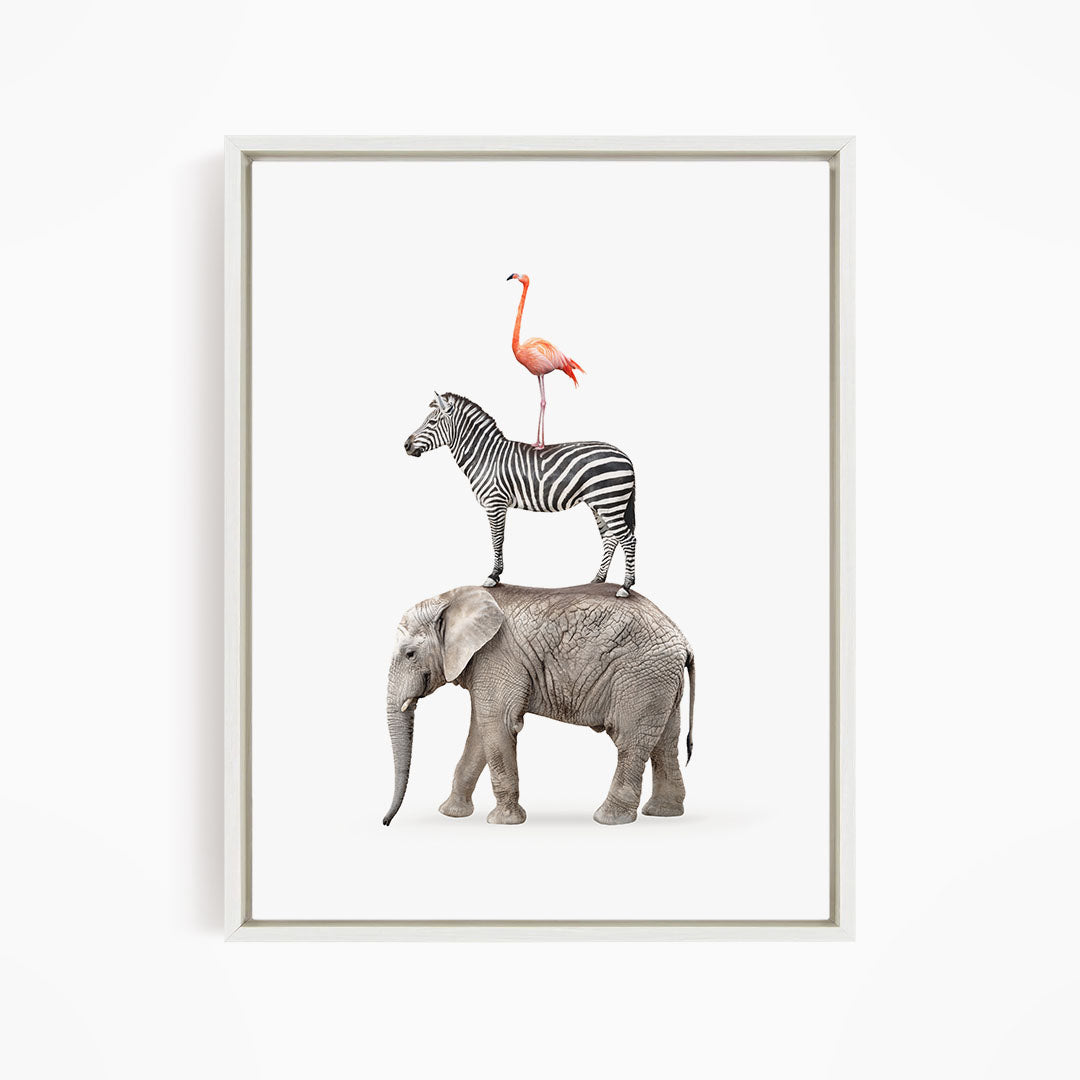 A framed image depicting a zebra, an elephant, and a flamingo standing together.