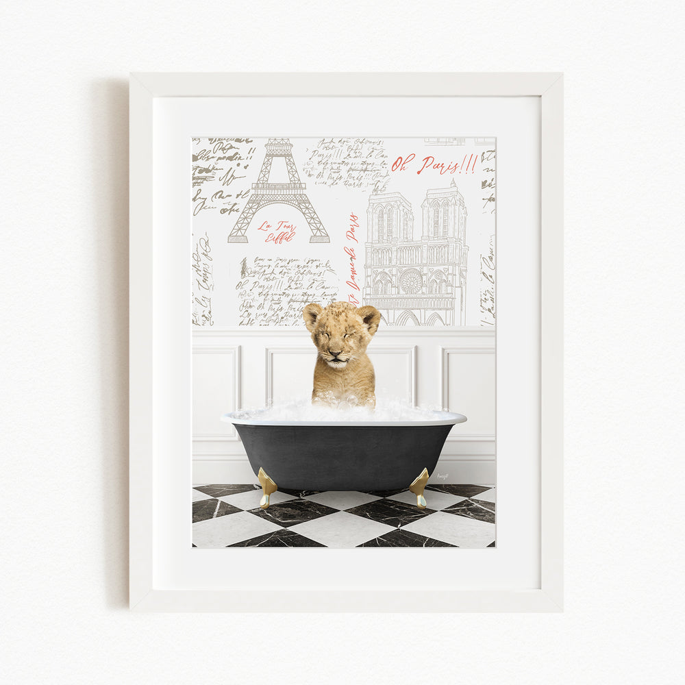 A young lion cub sitting in a bathtub filled with water, surrounded by a Paris-themed background with the Eiffel Tower and other landmarks.
