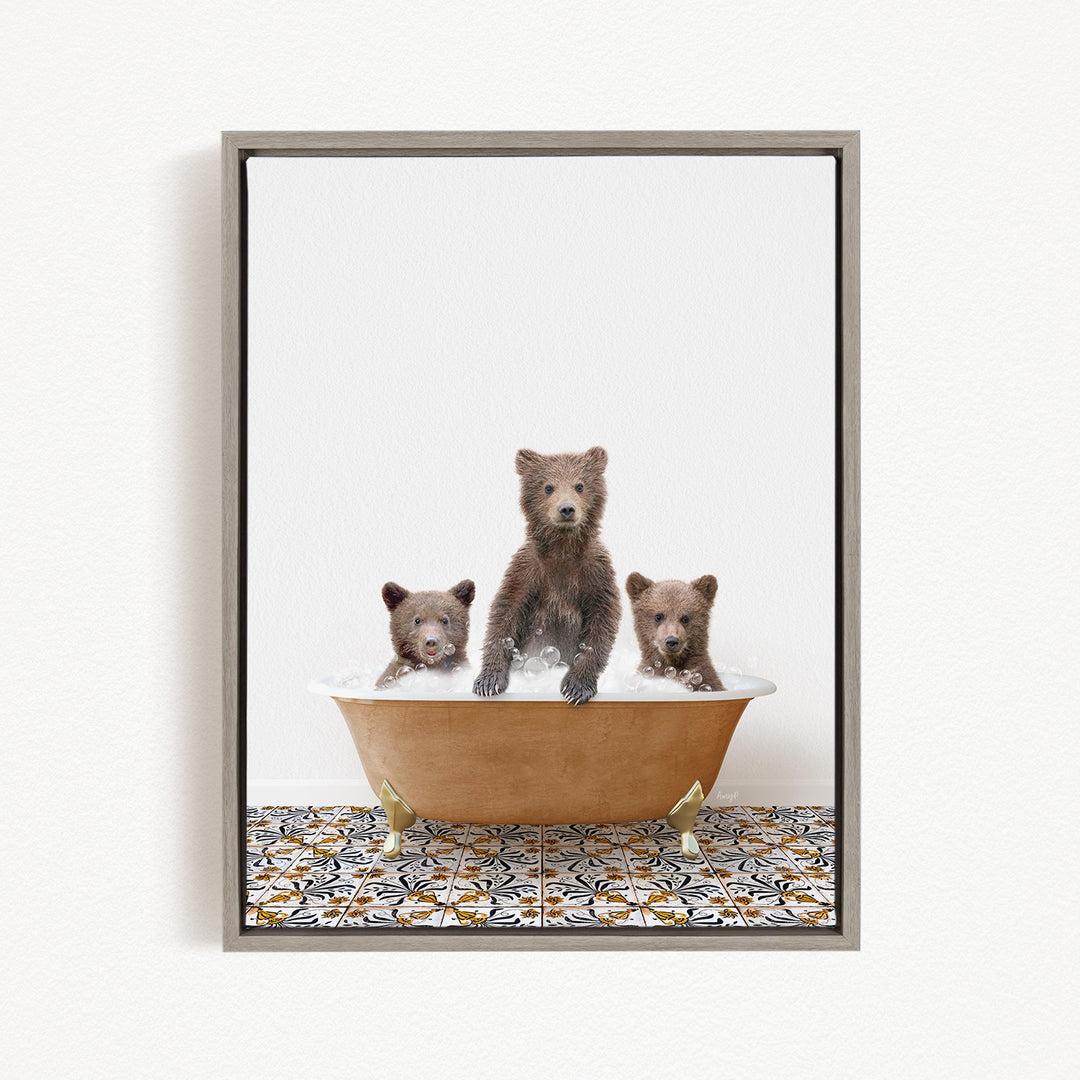 Three adorable brown bears sitting in a bathtub filled with water, creating a playful and whimsical scene.