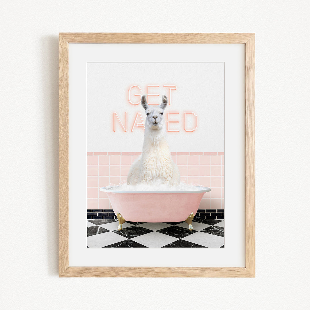 A framed image of a white llama sitting in a pink bathtub, with the text "GET NAKED" displayed above it.