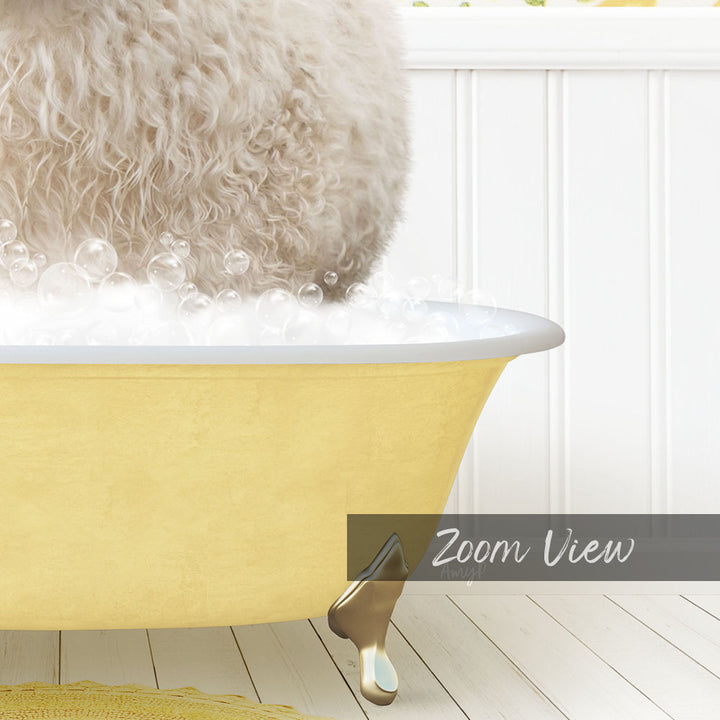 A fluffy white dog is sitting in a yellow bathtub filled with bubbles, with a white wall and wooden floor in the background.