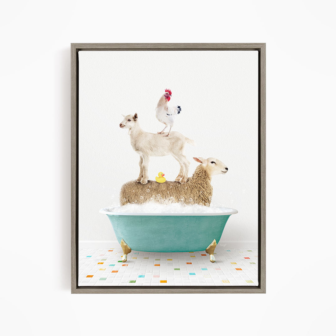 A framed image depicting a sheep standing on a goat's back while a chicken stands on the sheep's back, all in a bathtub filled with bubbles.