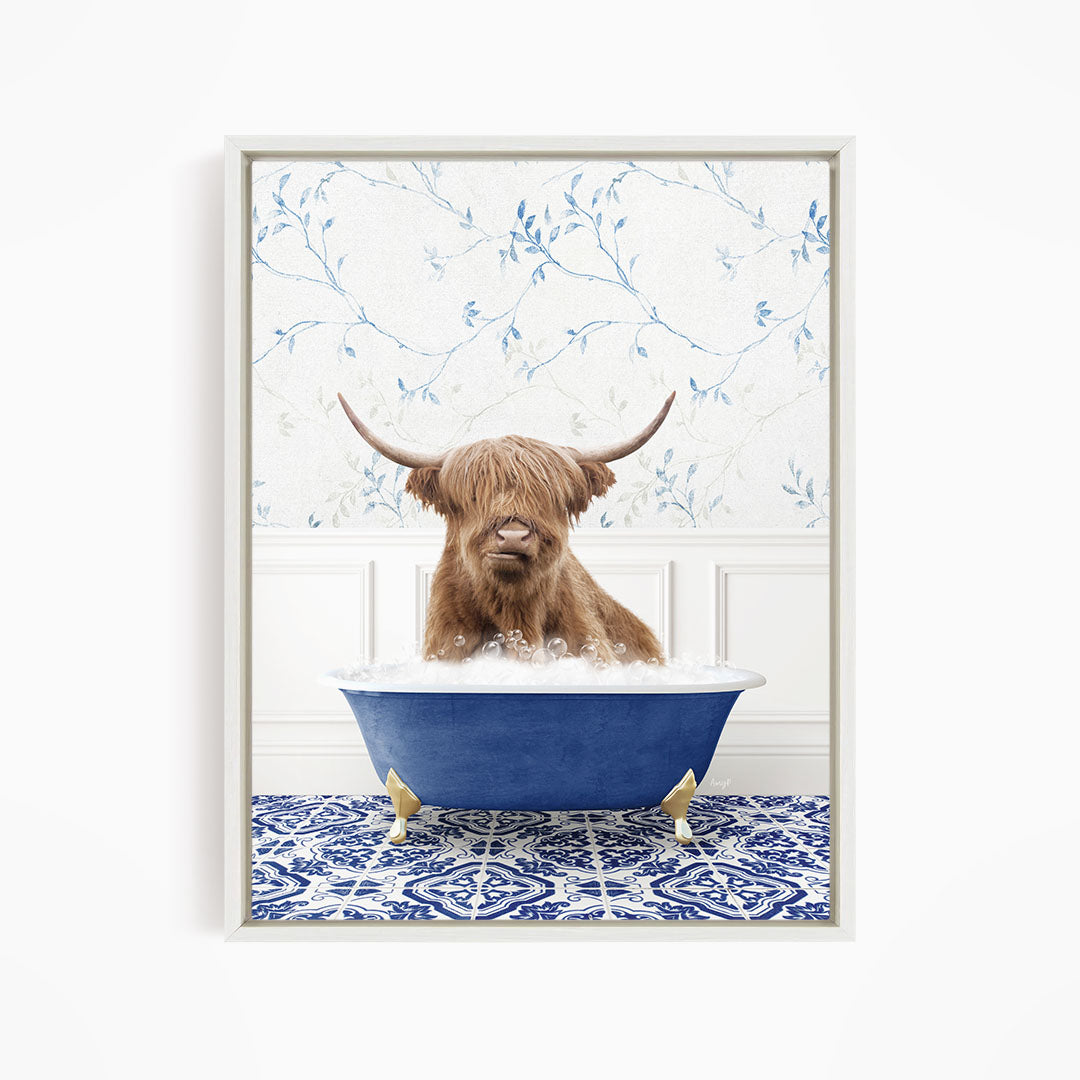 A brown cow with long horns is sitting in a blue bathtub, surrounded by a blue and white patterned floor.