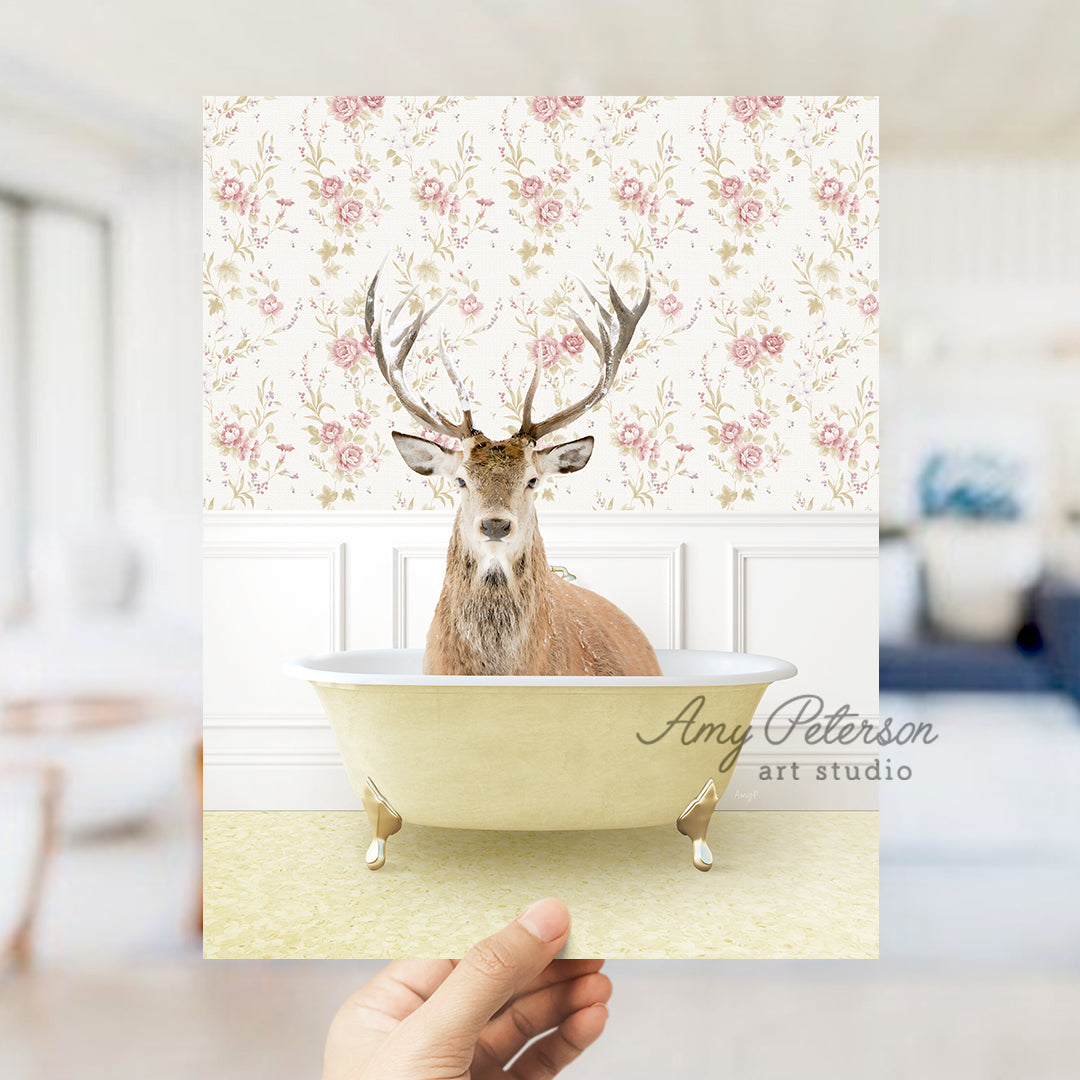 a hand holding up a card with a picture of a deer in a bathtub