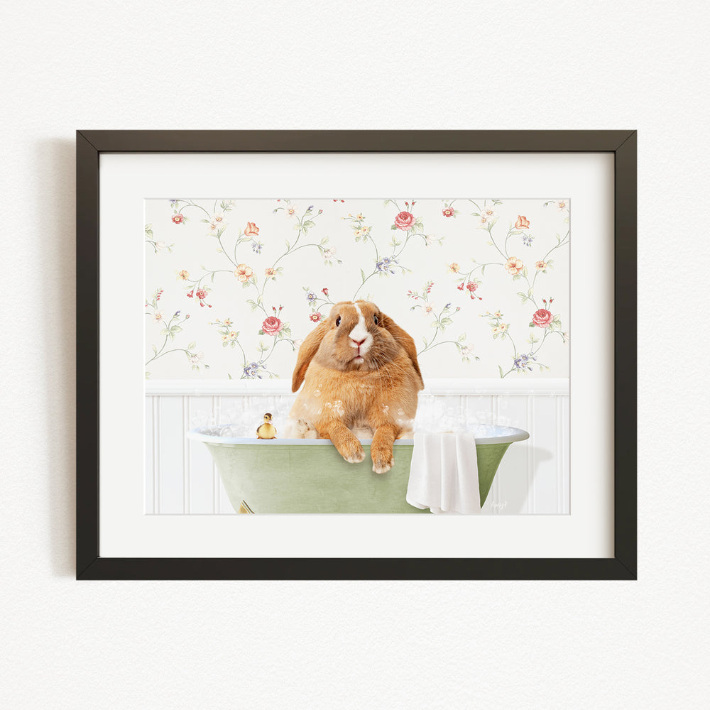 A brown rabbit sitting in a green bathtub filled with water, surrounded by a floral patterned wall.