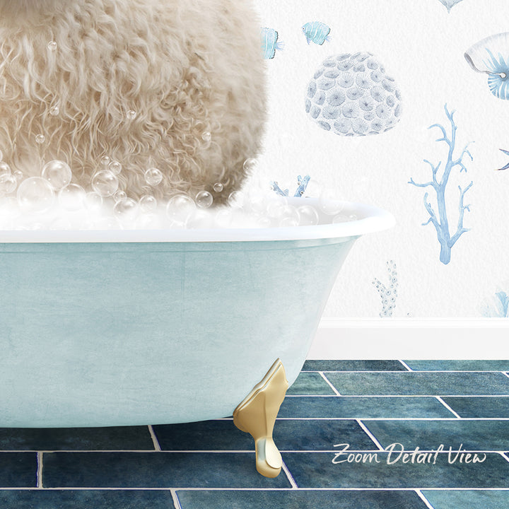 A fluffy white dog is sitting in a bathtub filled with bubbles, with a blue and white underwater wallpaper in the background.