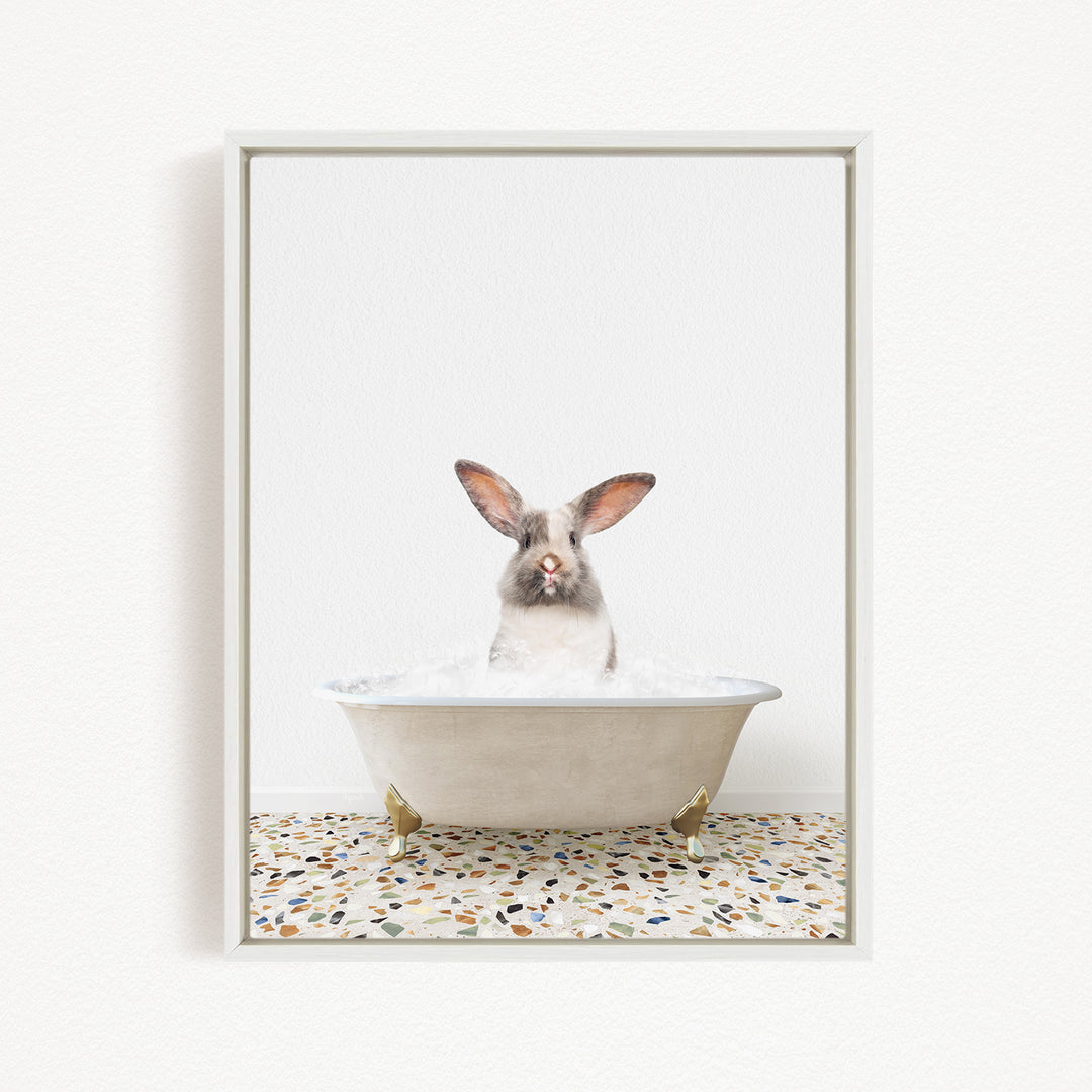 A white rabbit sitting in a white bathtub filled with water, with its head above the water level.
