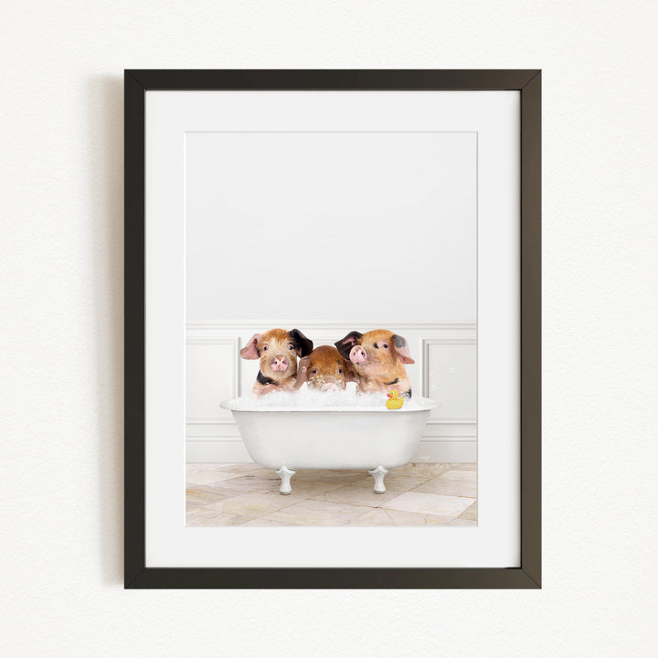 Three adorable pigs sitting in a white bathtub, enjoying a relaxing bath together.
