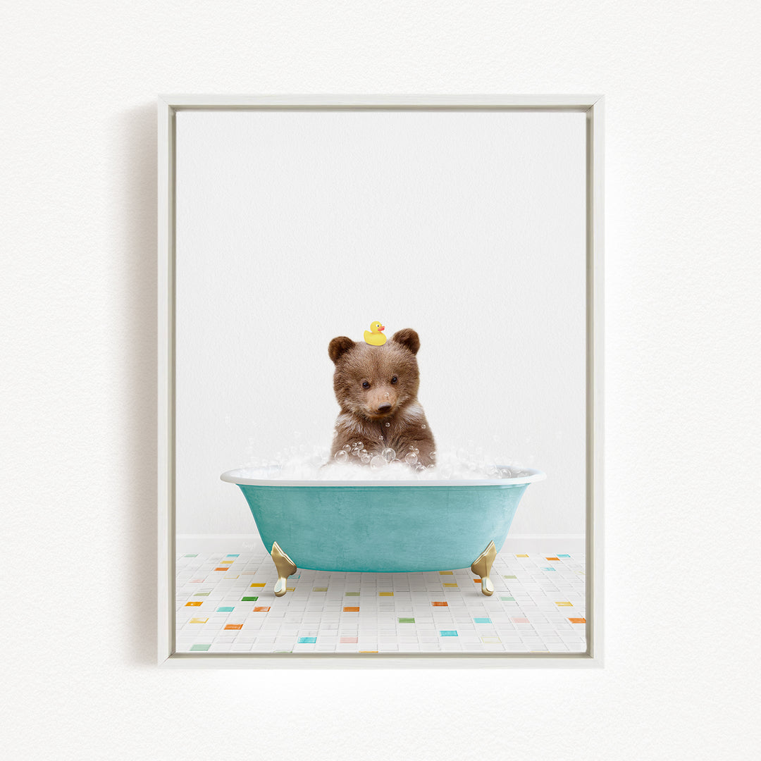 A brown bear sitting in a blue bathtub filled with bubbles, with a rubber duck floating on the water.