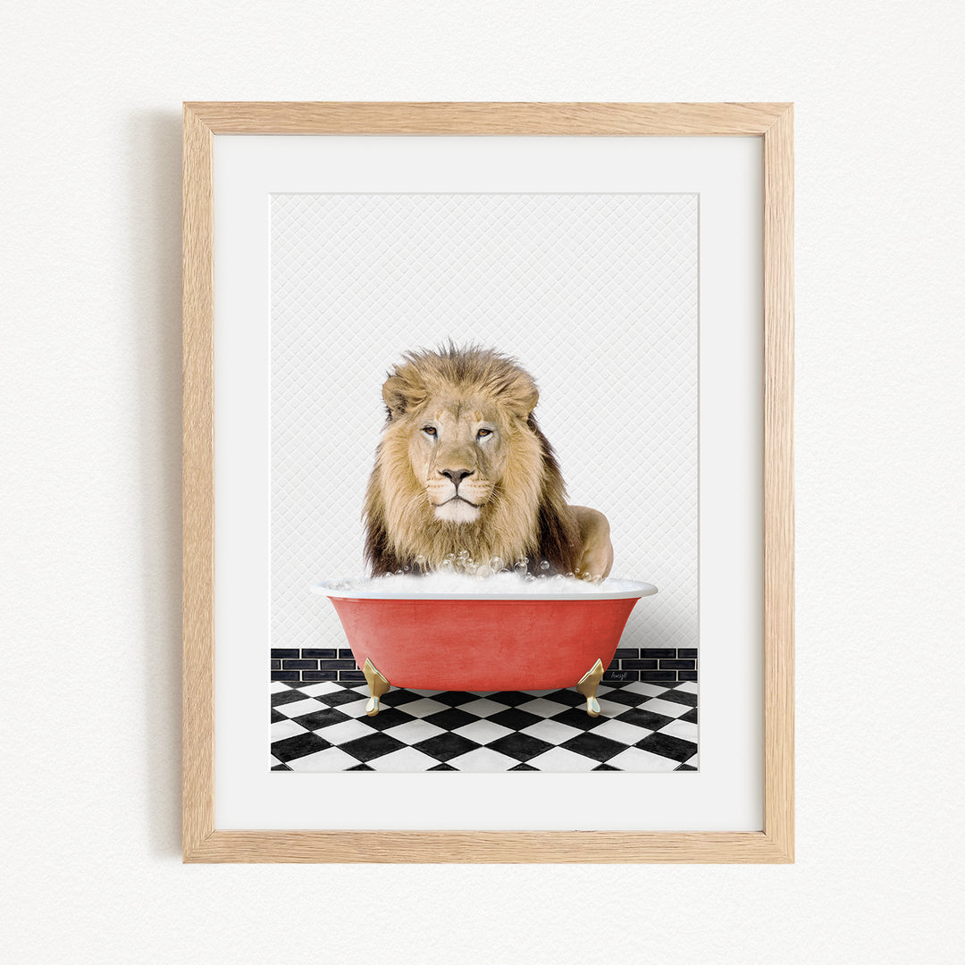 A lion sitting in a red bathtub on a black and white checkered floor.
