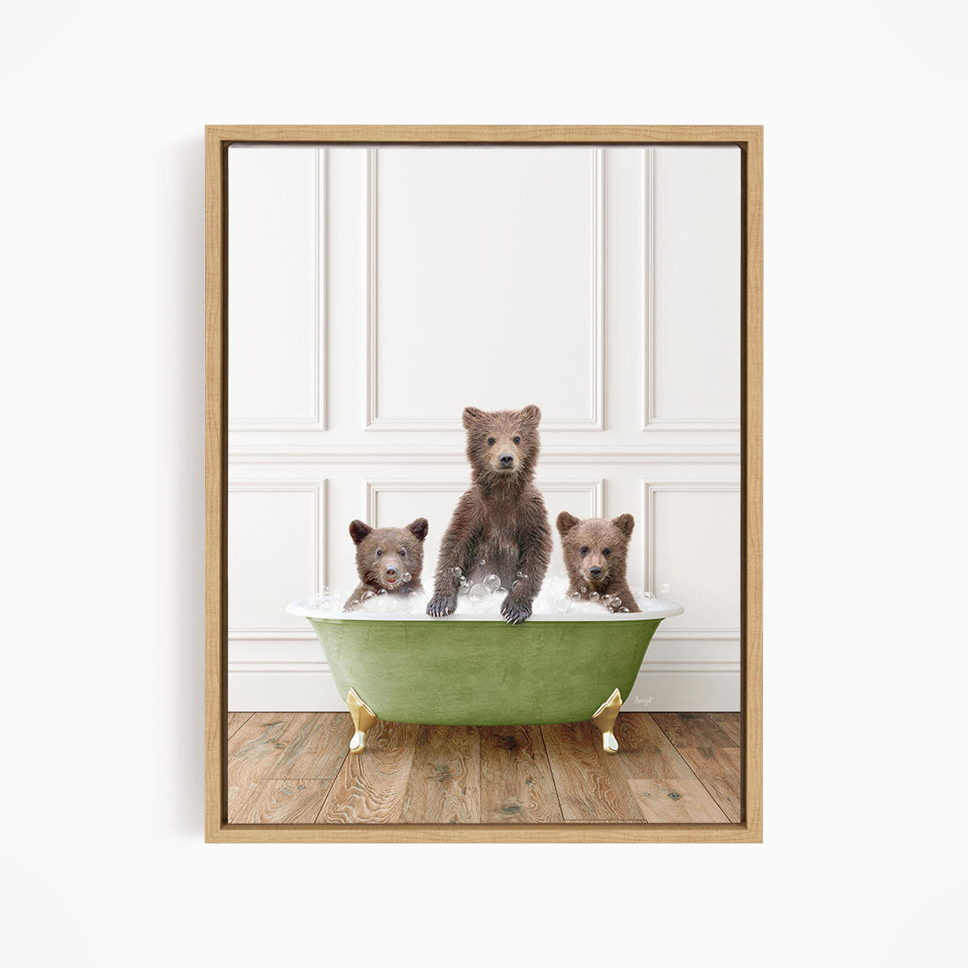 A framed image depicting three bears sitting in a green bathtub, with one bear sitting in the center and the other two bears sitting on either side.