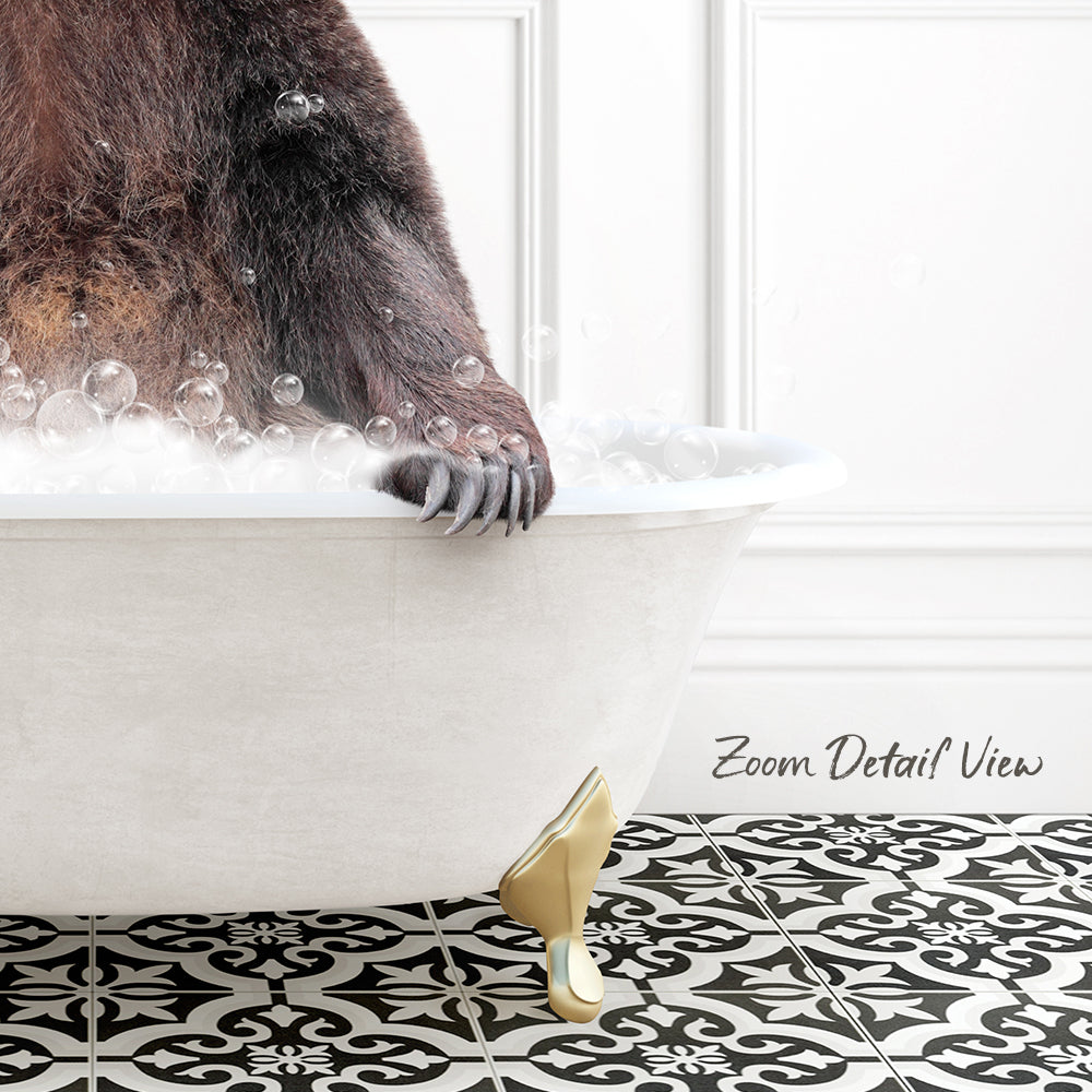 A close-up of a bear's paw resting on the edge of a white bathtub filled with bubbles, with a black and white patterned floor in the background.