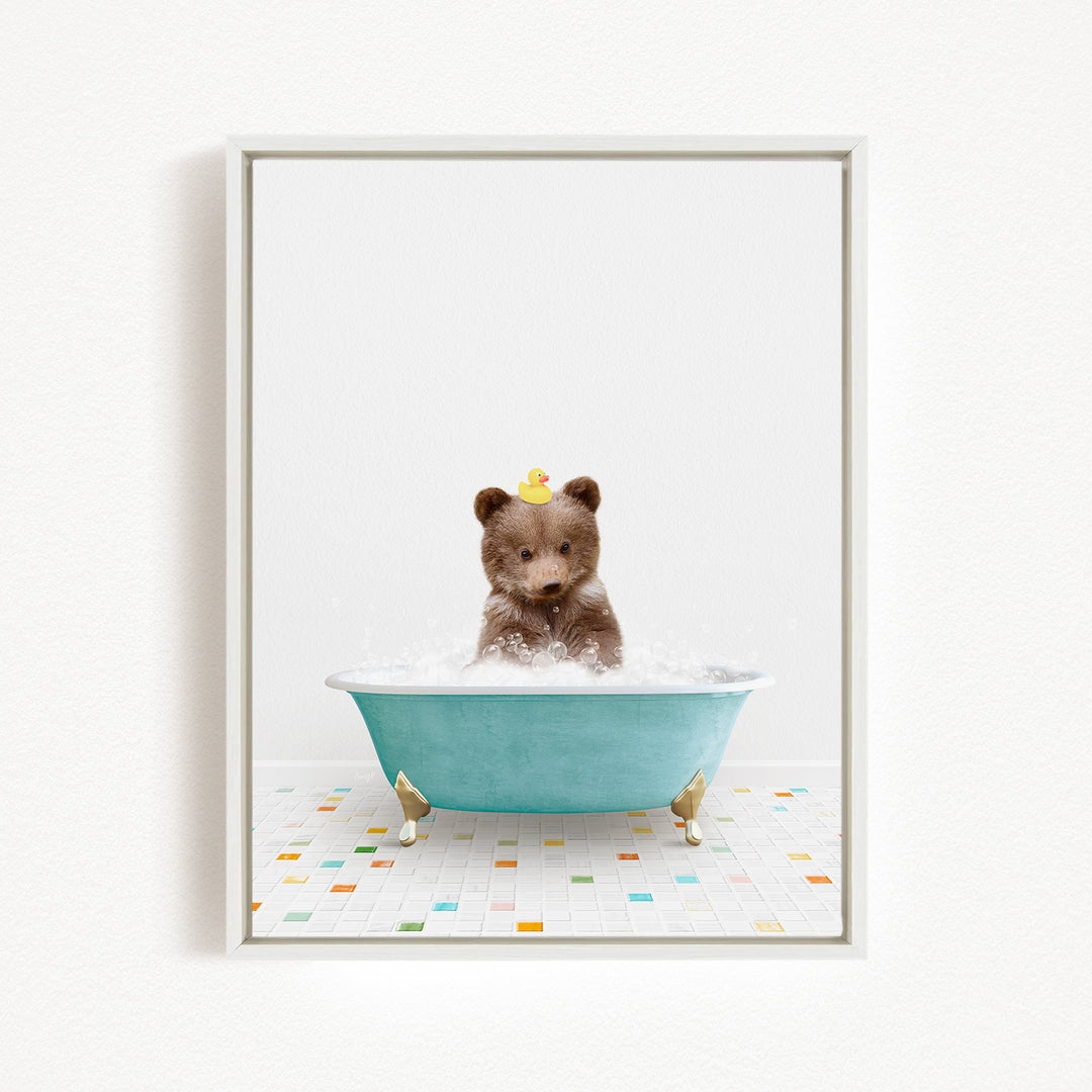 A brown bear sitting in a blue bathtub filled with water, with a rubber duck floating on its head.