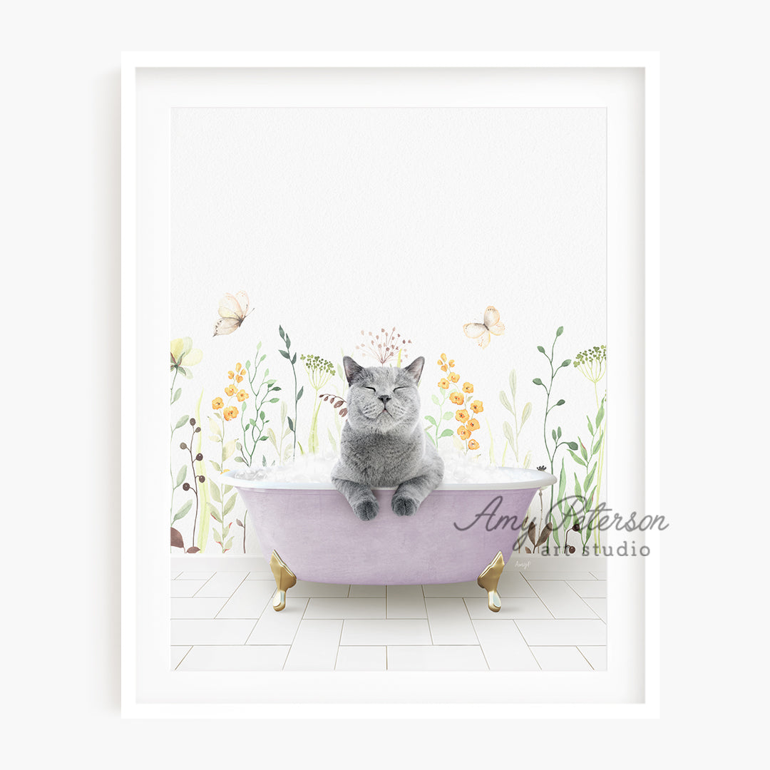 a cat sitting in a bathtub with flowers on the wall