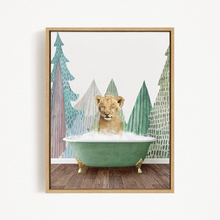 A young lion cub is sitting in a green bathtub, surrounded by a forest-themed background with trees and snow.