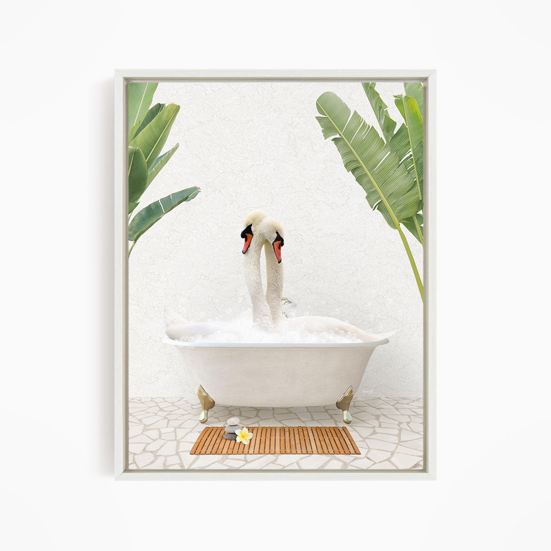 A pair of swans sitting in a white bathtub, surrounded by green leaves, creating a serene and relaxing scene.