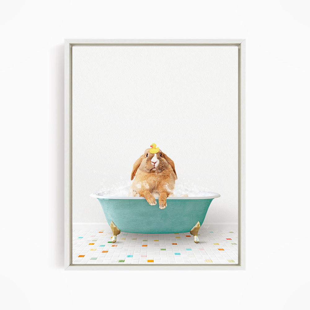 A brown rabbit sitting in a green bathtub filled with bubbles, wearing a yellow rubber duck hat.
