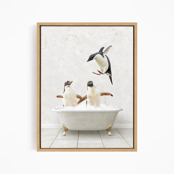 A framed image depicting two penguins sitting in a bathtub, with one penguin flying towards the other.