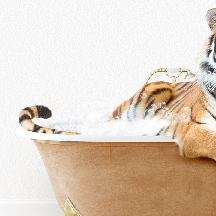 a stuffed tiger is sitting in a bathtub