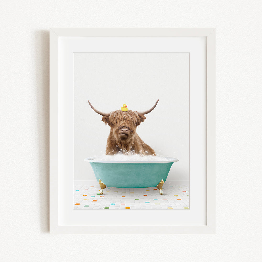 A brown cow with long horns is sitting in a blue bathtub, with a yellow rubber duck perched on its head.