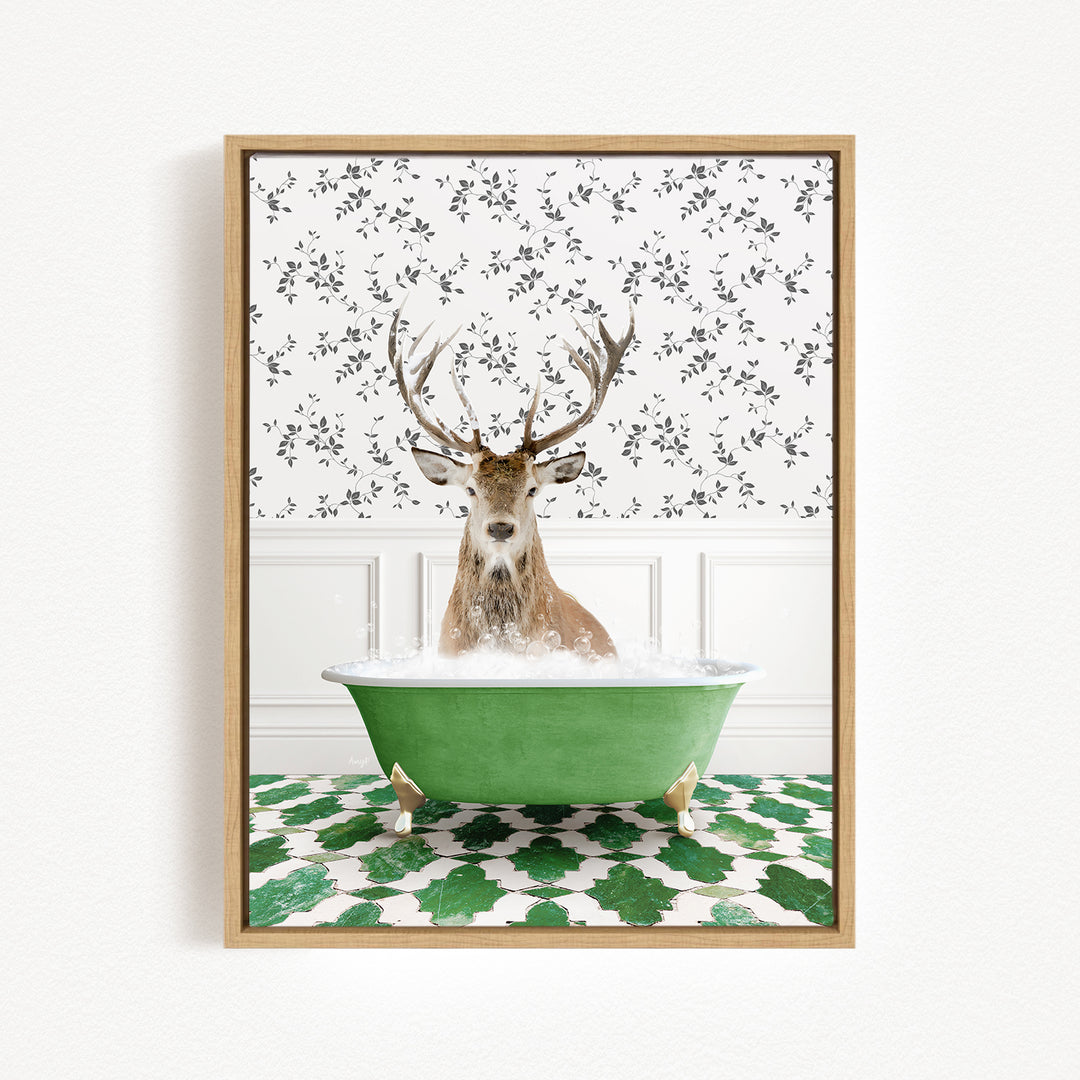A deer with antlers is sitting in a green bathtub filled with bubbles, surrounded by a patterned tile floor and a white wall with a floral pattern.