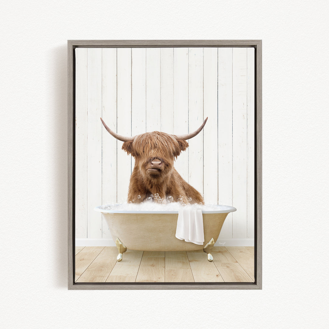 A Highland cow with long horns is sitting in a bathtub filled with water, creating a whimsical and humorous scene.