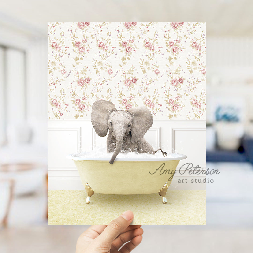 a person holding up a card with an elephant in a bathtub