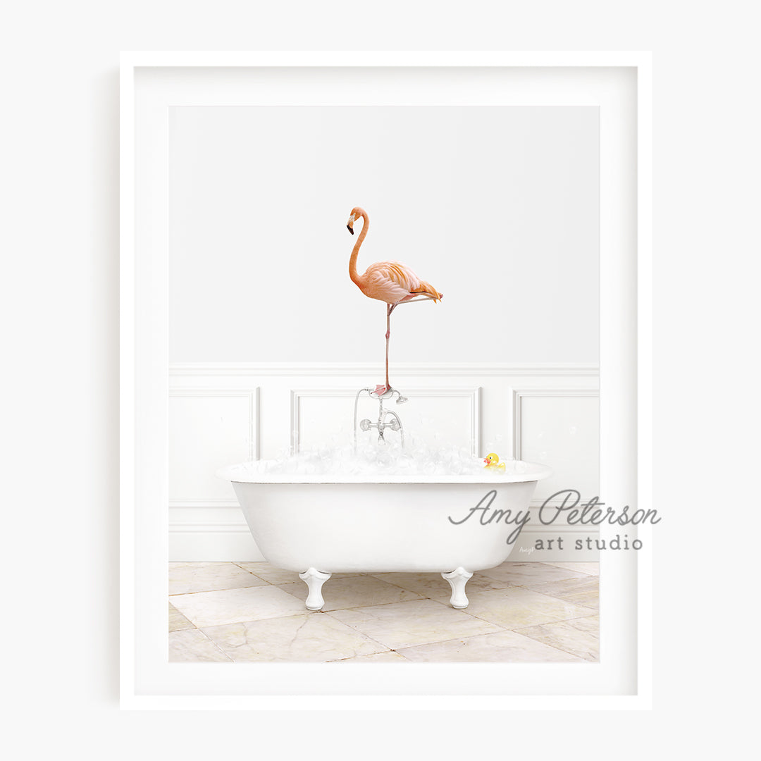 a pink flamingo standing on top of a bathtub